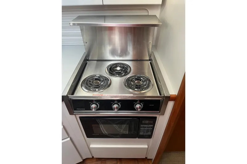 Slide: The Image of Stainless steel stove and oven in 1993 Carver 350 Aft Cabin Motor Yacht kitchen. - 33