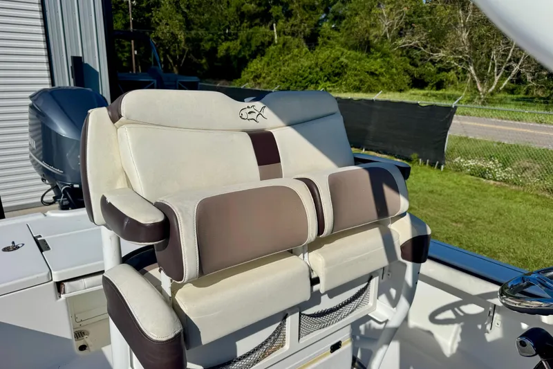 Slide: The Image of 2017 Crevalle 26 Bay boat seat with cushioned backrest and armrests. - 10