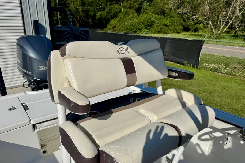 Slide: The Image of 2017 Crevalle 26 Bay boat seat with dual Yamaha 300 engines in background. - 11