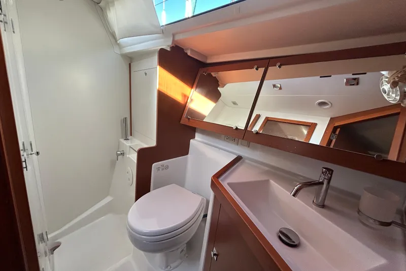 Slide: The Image of 2014 Beneteau Oceanis 41 yacht bathroom with modern fixtures and ample lighting. - 13