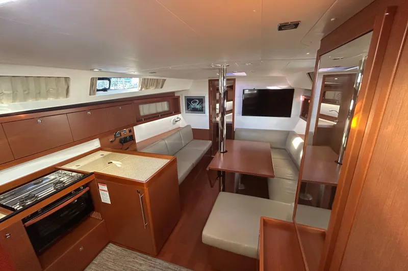 Slide: The Image of Interior of 2014 Beneteau Oceanis 41 yacht with modern kitchen and seating area. - 15
