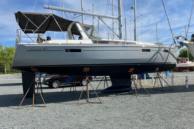 Slide: The Image of Sailboat on stands, Beneteau Oceanis 41, 2014 model, in a boatyard setting. - 2