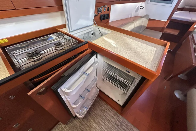 Slide: The Image of Galley of 2014 Beneteau Oceanis 41 with stove, fridge, and countertop. - 20