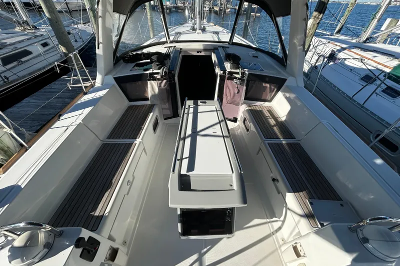 Slide: The Image of 2014 Beneteau Oceanis 41 sailboat cockpit with seating and helm, docked at marina. - 26
