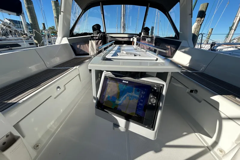 Slide: The Image of Cockpit of 2014 Beneteau Oceanis 41 sailboat with navigation display and seating. - 31