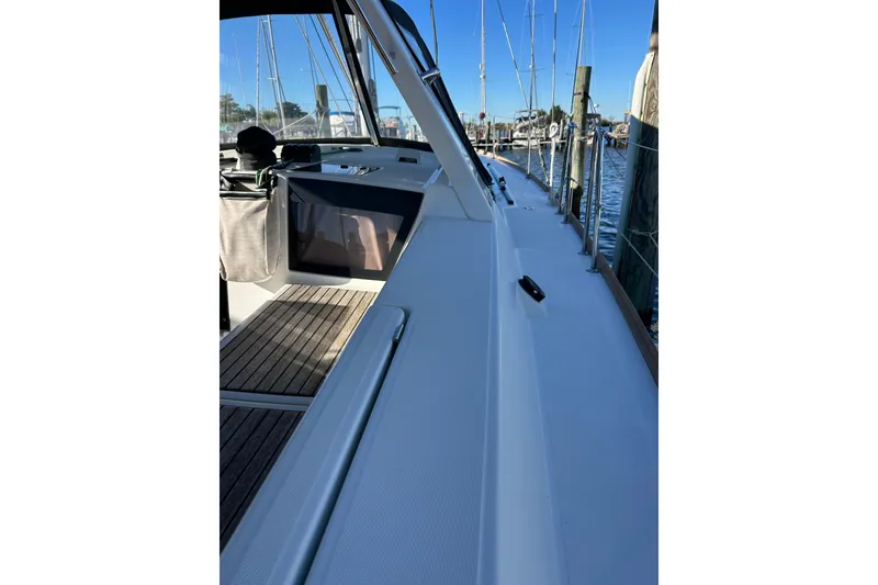 Slide: The Image of 2014 Beneteau Oceanis 41 sailboat deck with marina view. - 34
