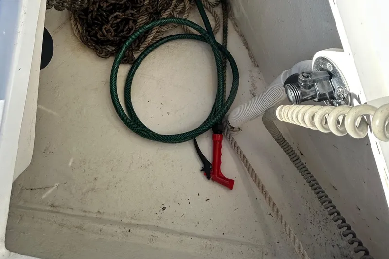 Slide: The Image of Storage compartment of 2014 Beneteau Oceanis 41 with hose and ropes. - 36