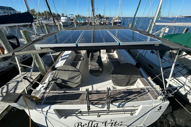 Slide: The Image of 2014 Beneteau Oceanis 41 sailboat with solar panels docked at marina. - 38