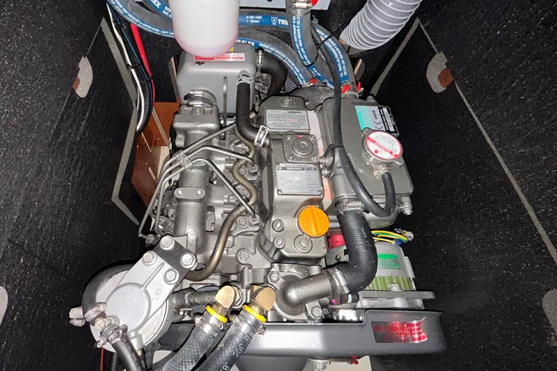 Slide: The Image of Engine compartment of a 2014 Beneteau Oceanis 41 sailboat, showcasing detailed mechanical components. - 41