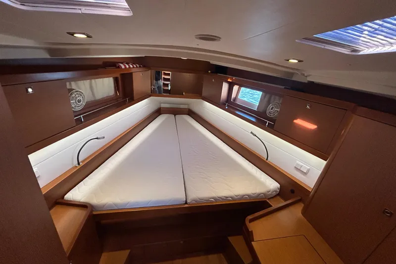 Slide: The Image of Interior cabin of 2014 Beneteau Oceanis 41 yacht with cozy bed and wooden finish. - 7