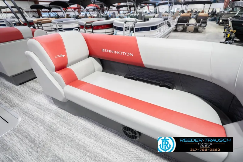 Slide: The Image of 2026 Bennington 22 SLJ boat interior with red and gray seating at Reeder-Trausch Marine. - 22