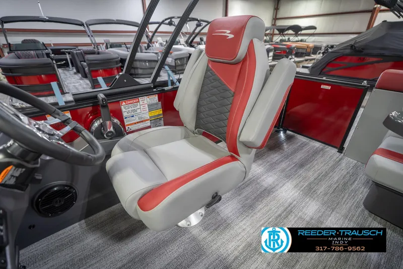 Slide: The Image of Captain's chair in 2026 Bennington 22 SLJ pontoon boat, featuring red and gray upholstery. - 25