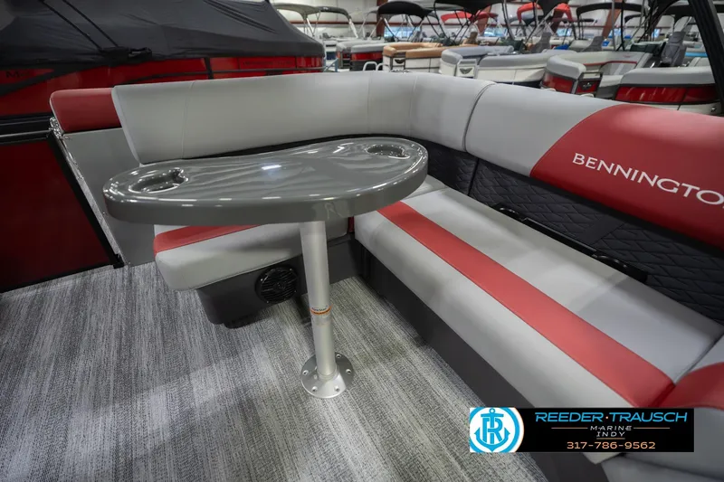 Slide: The Image of 2026 Bennington 22 SLJ boat interior with gray and red seating and table. - 27