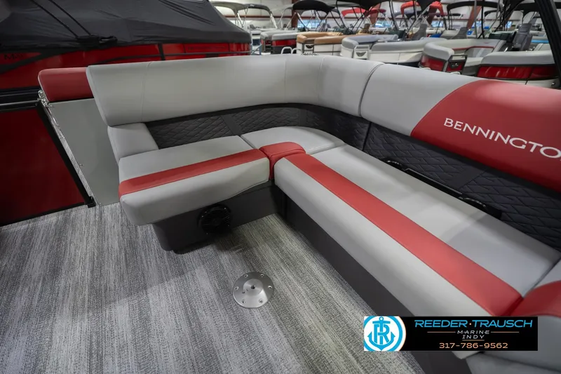 Slide: The Image of 2026 Bennington 22 SLJ boat interior with red and gray seating, showcased at Reeder Trausch Marine. - 28