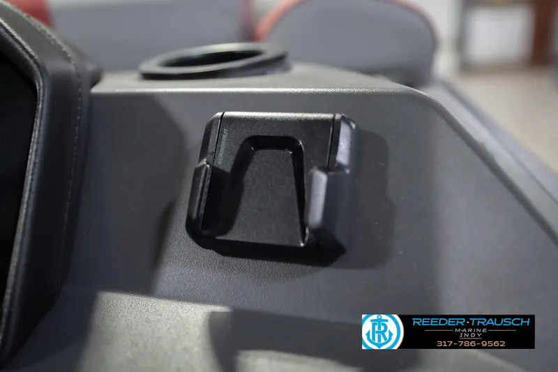 Slide: The Image of 2026 Bennington 22 SLJ boat interior detail with cup holder and accessory mount. - 37