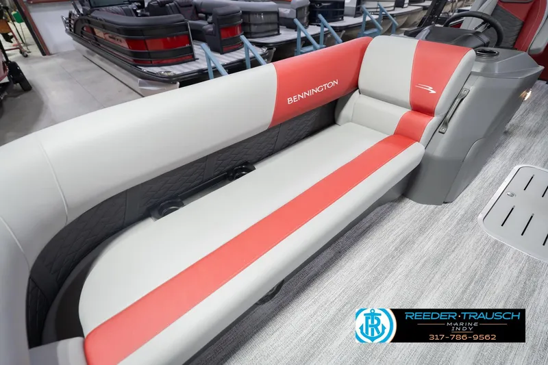 Slide: The Image of 2026 Bennington 22 SLJ boat interior with red and gray seating at Reeder-Trausch Marine. - 43