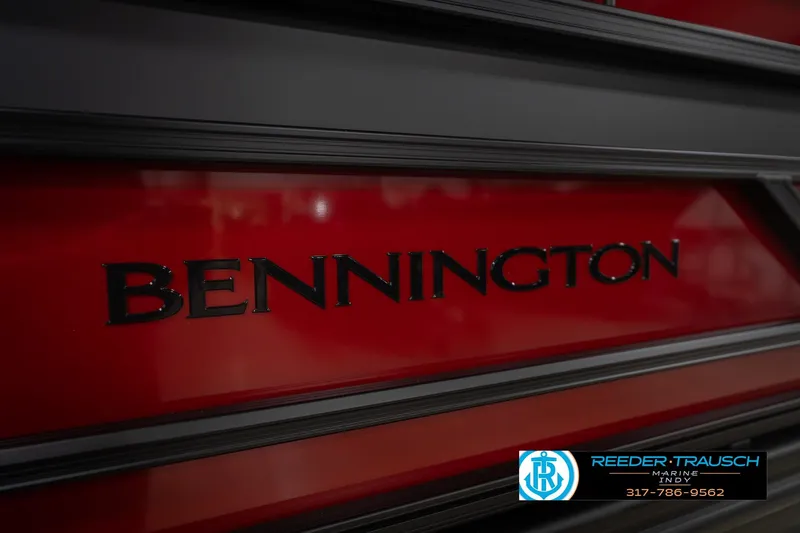 Slide: The Image of 2026 Bennington 22 SLJ boat with red and black detailing, Reeder-Trausch Marine logo. - 47