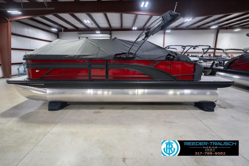 Slide: The Image of 2026 Bennington 22 SLJ pontoon boat with cover in indoor showroom. - 58