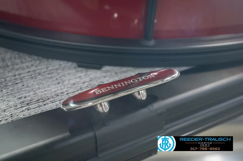 Slide: The Image of Close-up of 2026 Bennington 22 SLJ boat cleat with logo, Reeder-Trausch Marine branding. - 59