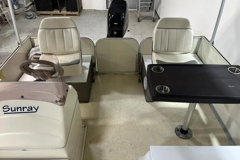 Slide: The Image of 2022 Fiesta 16 Fish N Fun boat interior with seating and table. - 5