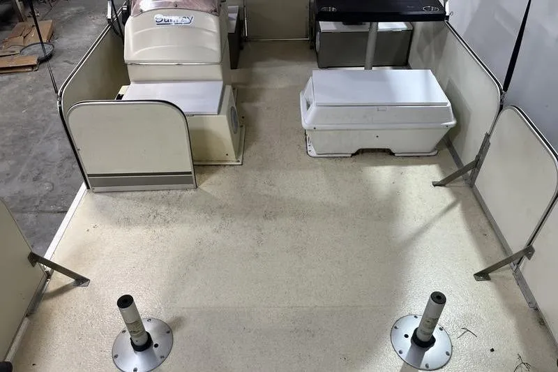 Slide: The Image of 2022 Fiesta 16 Fish N Fun boat interior with seating and storage compartments. - 7