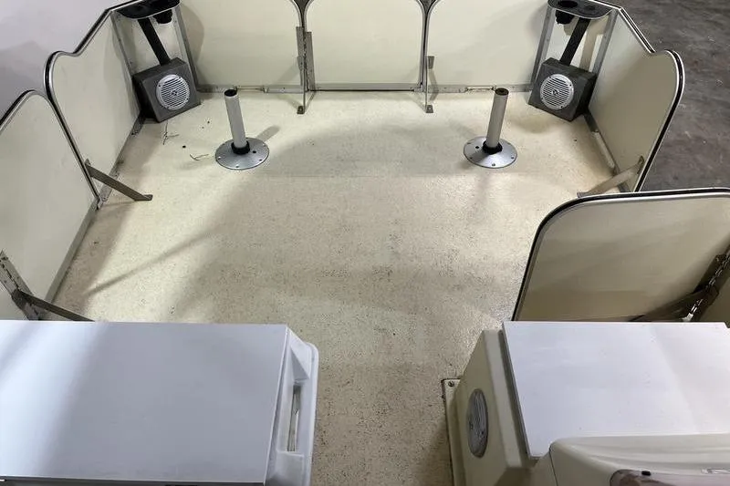 Slide: The Image of 2022 Fiesta 16 Fish N Fun boat interior with seating and storage compartments. - 8