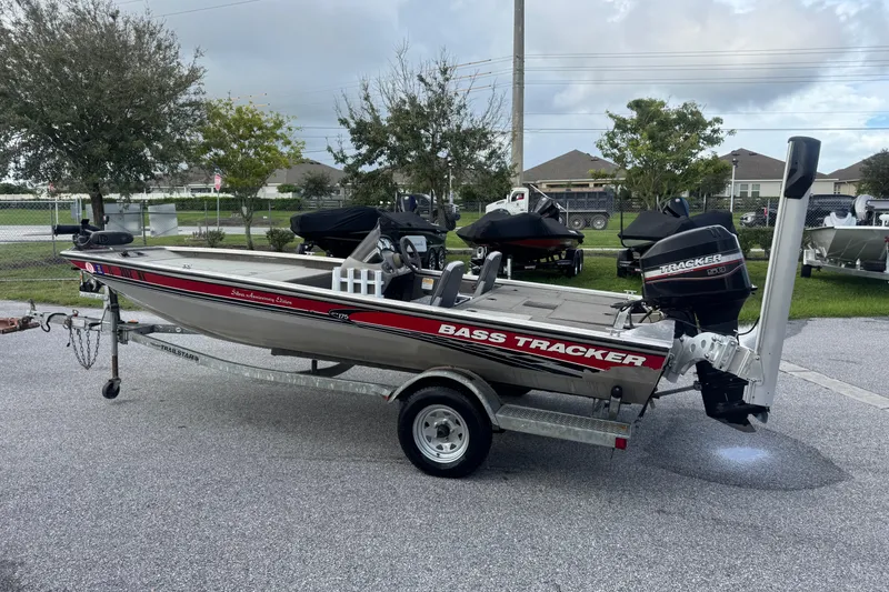 The Image of 2020 Tracker Bass Tracker boat on trailer, parked outdoors. - 0