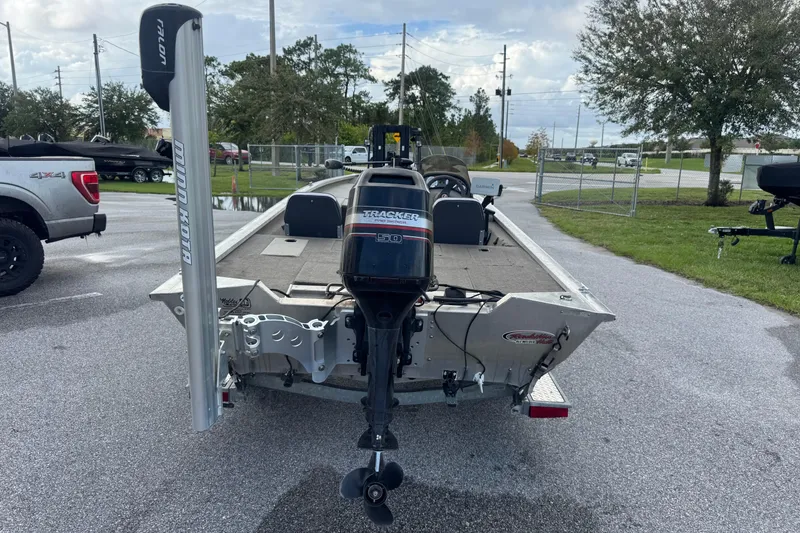 Slide: The Image of 2020 Tracker boat with Minn Kota motor in a parking lot. - 6