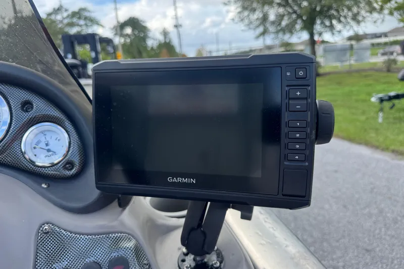 Slide: The Image of Garmin GPS device on a 2020 Tracker boat dashboard with gauges visible. - 9