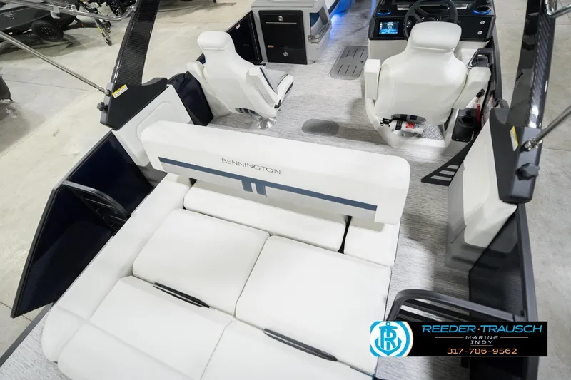 Slide: The Image of 2026 Bennington 24 MCSB boat interior with white seating and modern helm. - 14