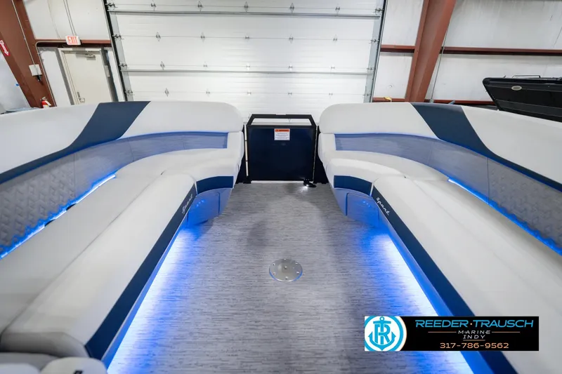 Slide: The Image of Interior of 2026 Bennington 24 MCSB pontoon boat with blue LED lighting. - 22