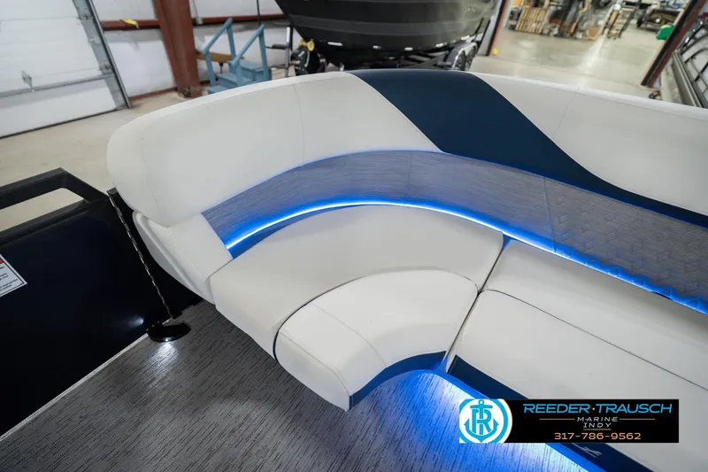 Slide: The Image of Luxurious seating on 2026 Bennington 24 MCSB boat with blue LED lighting. - 26