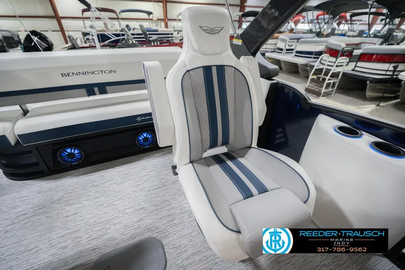 Slide: The Image of 2026 Bennington 24 MCSB boat interior with stylish seating and cup holders. - 28