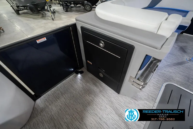 Slide: The Image of 2026 Bennington 24 MCSB boat interior with seating and storage compartment. - 30