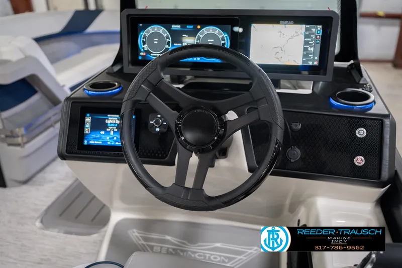 Slide: The Image of 2026 Bennington 24 MCSB boat dashboard with steering wheel and digital displays. - 37