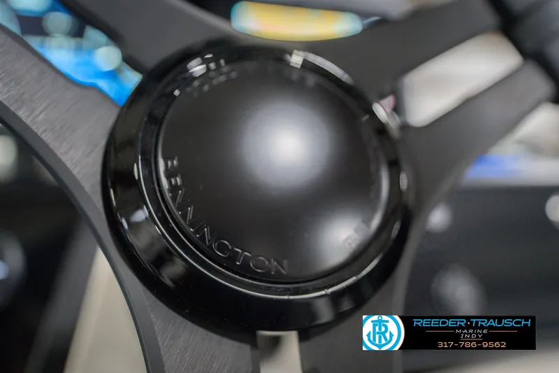 Slide: The Image of Close-up of Bennington 24 MCSB 2026 steering wheel with Reeder-Trausch Marine logo. - 39