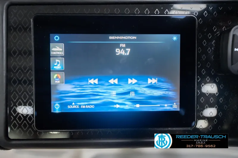 Slide: The Image of Touchscreen display of 2026 Bennington 24 MCSB showing FM radio controls. - 40