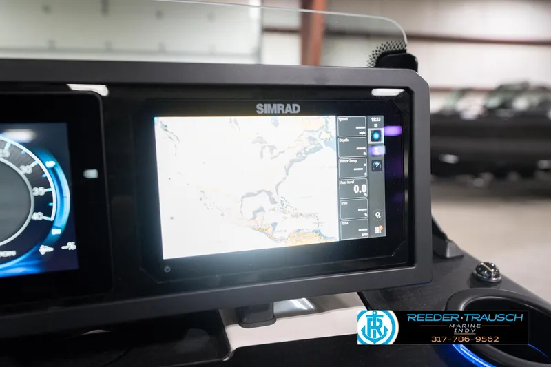 Slide: The Image of Simrad display on 2026 Bennington 24 MCSB boat dashboard, showing navigation and performance data. - 43