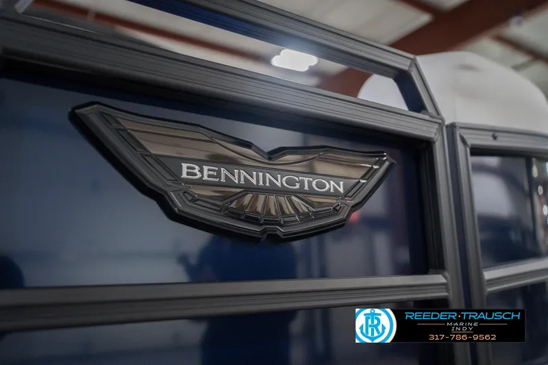 Slide: The Image of 2026 Bennington 24 MCSB boat logo with Reeder-Trausch Marine contact details. - 56