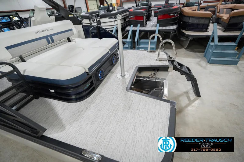 Slide: The Image of 2026 Bennington 24 MCSB pontoon boat interior with seating and swim ladder. - 65