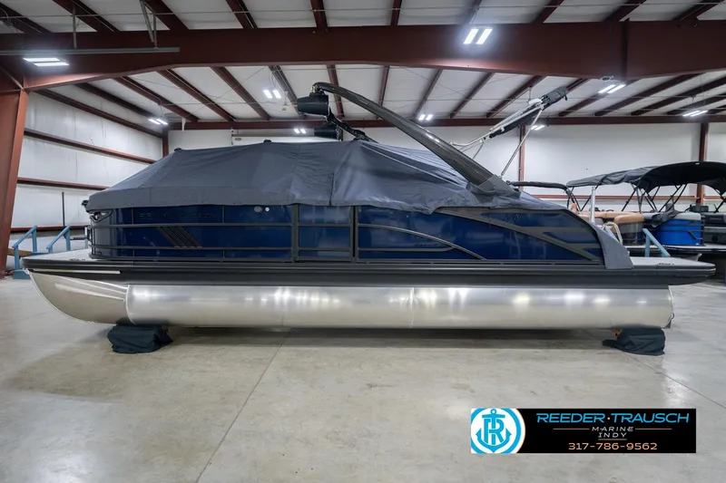 Slide: The Image of 2026 Bennington 24 MCSB pontoon boat in indoor storage, covered and secured. - 66