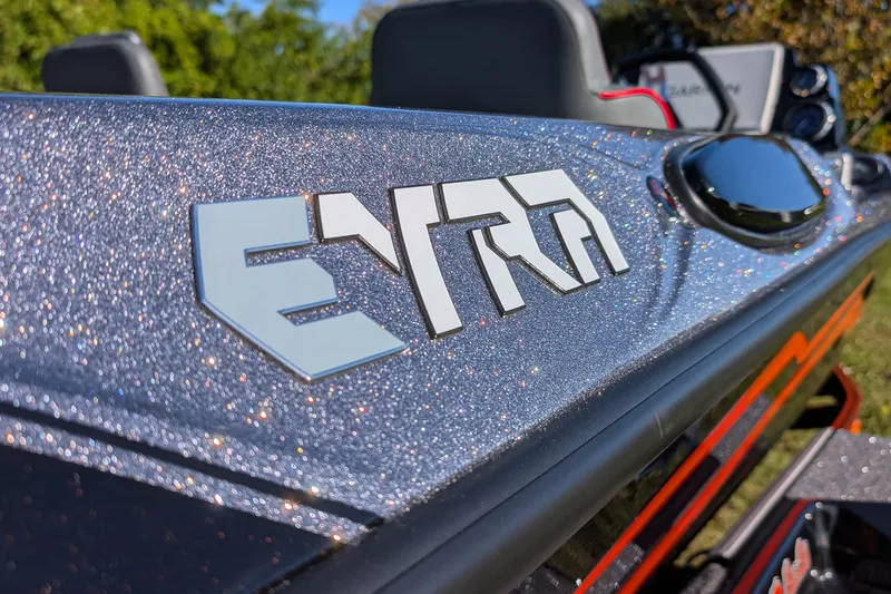 Slide: The Image of 2026 Bass Cat Eyra SP boat with glittery finish and bold logo. - 11