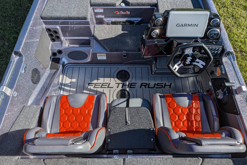 Slide: The Image of 2026 Bass Cat Eyra SP boat interior with Garmin system and "Feel the Rush" flooring. - 14