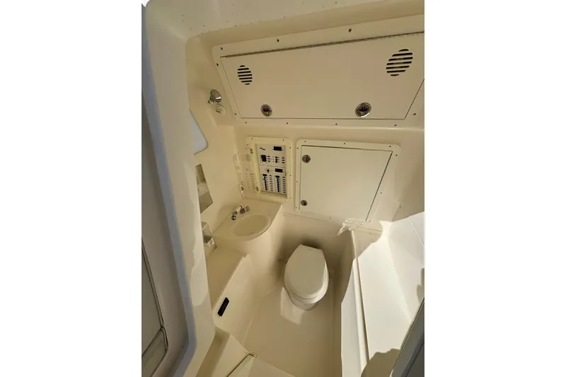 Slide: The Image of 2019 SeaVee 370z boat interior bathroom with toilet and sink. - 13