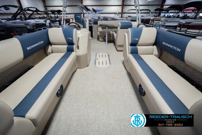 Slide: The Image of 2026 Bennington 21 SLJ pontoon boat interior with beige and blue seating. - 12