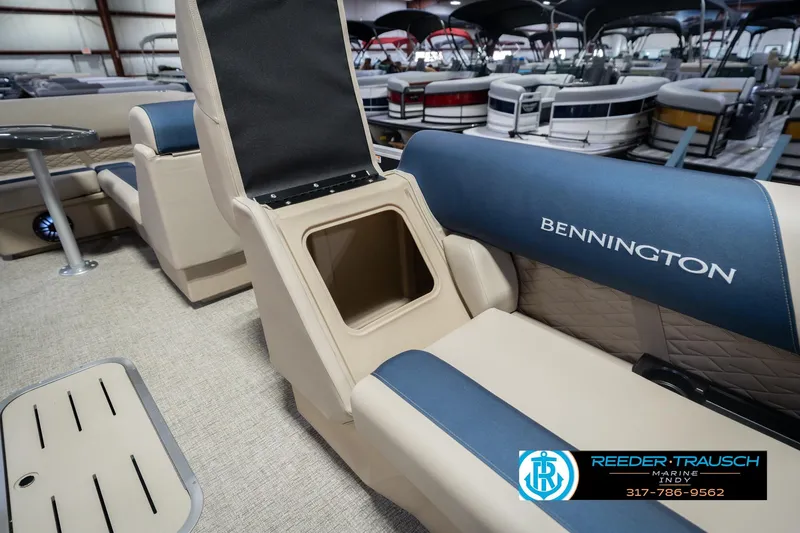 Slide: The Image of 2026 Bennington 21 SLJ boat interior with storage compartment and blue seating. - 20