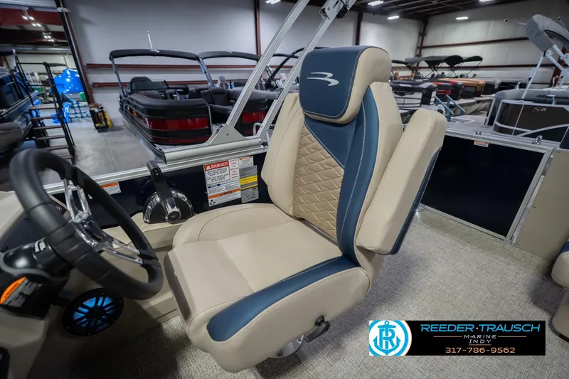 Slide: The Image of Captain's chair in a 2026 Bennington 21 SLJ pontoon boat, showroom setting. - 21