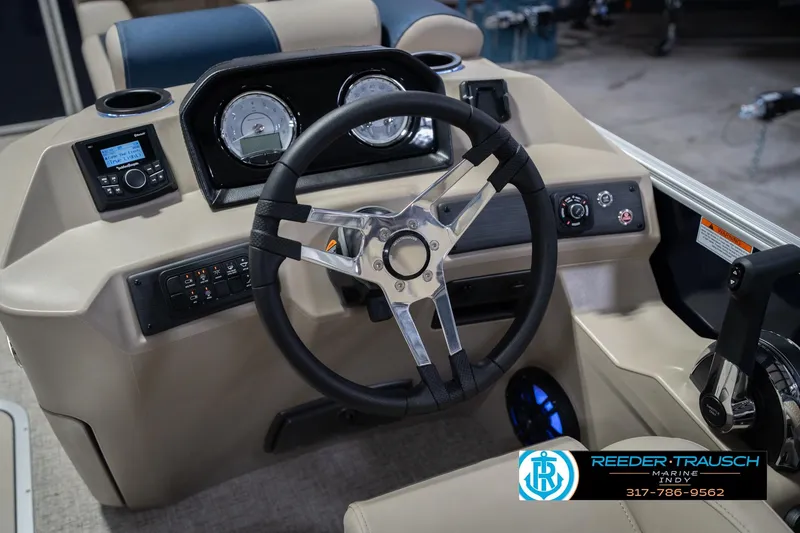 Slide: The Image of 2026 Bennington 21 SLJ boat dashboard with steering wheel and control panel. - 28