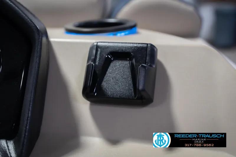 Slide: The Image of Close-up of a 2026 Bennington 21 SLJ boat dashboard with cup holder and accessory mount. - 33