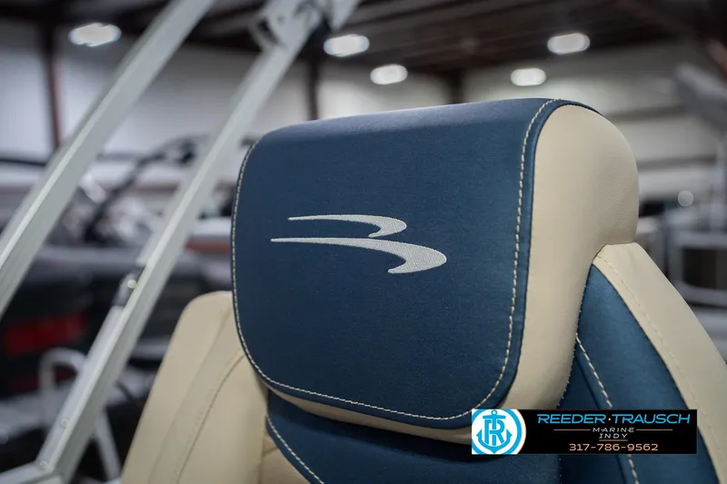 Slide: The Image of 2026 Bennington 21 SLJ boat seat with logo, showcased at Reeder-Trausch Marine Indy. - 37